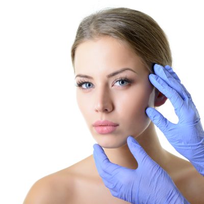 Beauty,Treatment,For,Young,Beautiful,Female,Face,,Doctor's,Hand,In